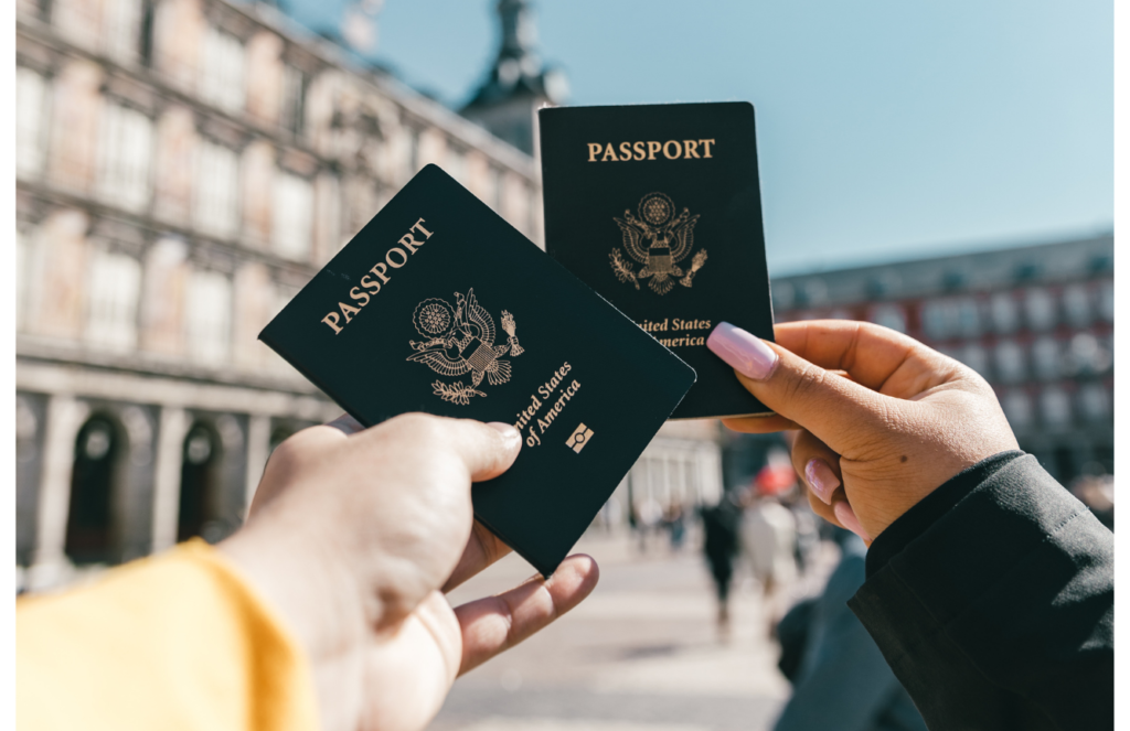 2 person holding passport