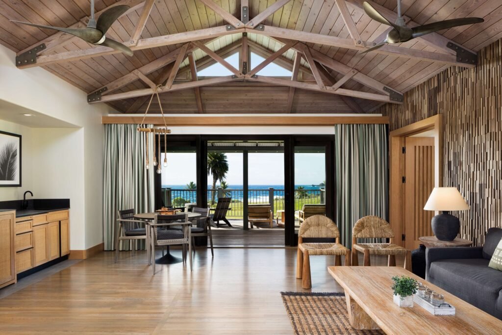 Hana-Maui Resort-Spacious living area with vaulted wood ceiling and ocean-view patio.
