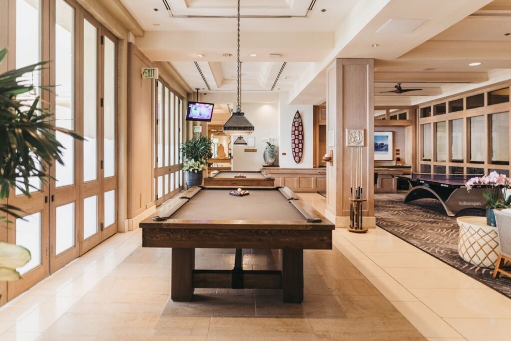 Elegant indoor game room with pool table and ping pong table in Four Seasons Resort Maui at Wailea